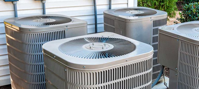 Residential HVAC condenser outside home